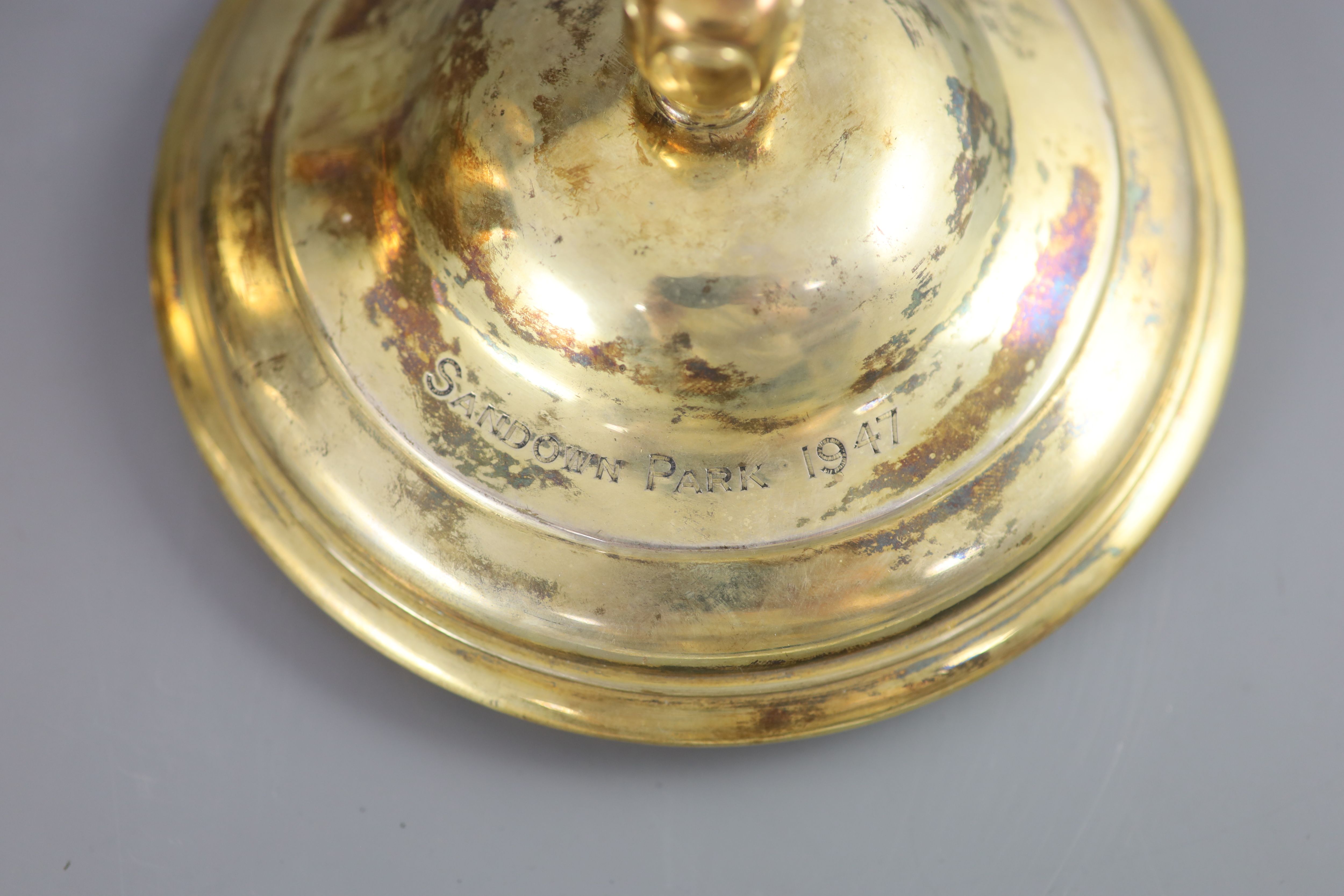 An Edwardian silver gilt-lidded two handled presentation cup and cover, by R & S Garrard and Co.